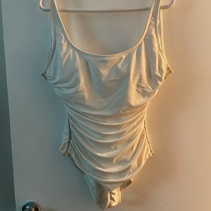 White one piece with gold accents